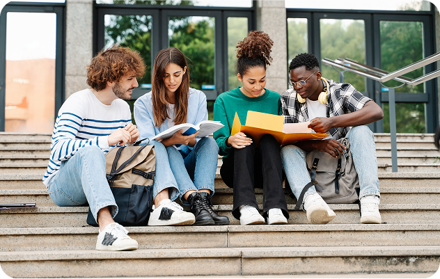 Group of students studying in staircase,